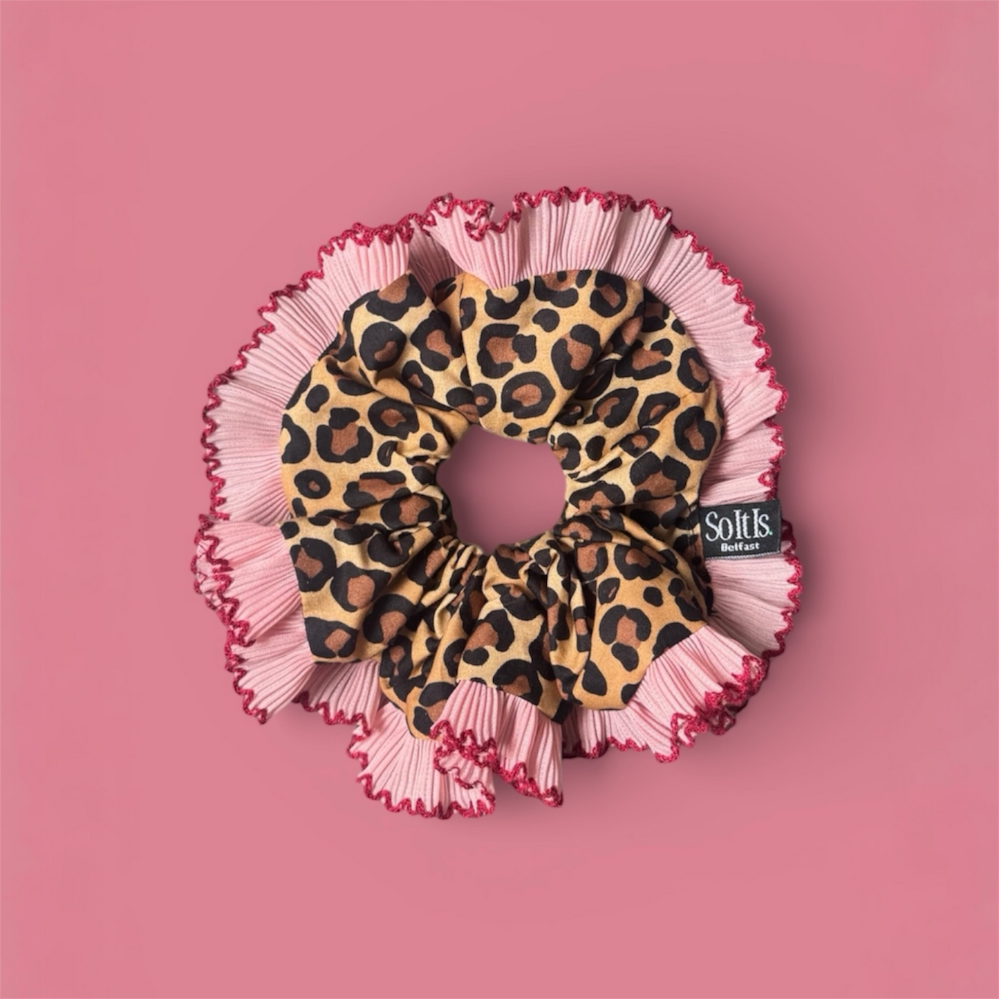 Leopard print scrunchie with pink & red pleated trim.