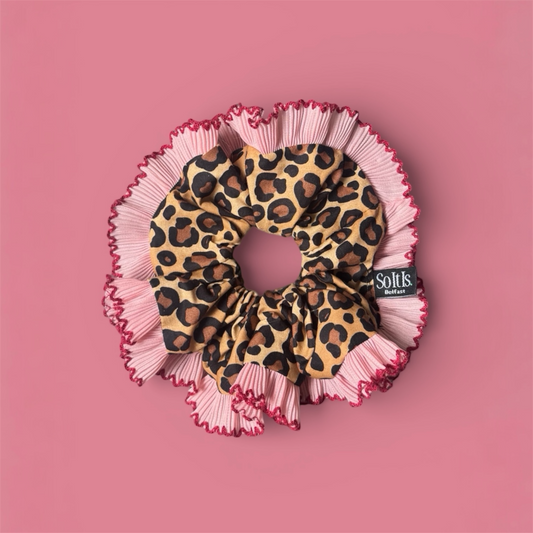 Leopard print scrunchie with pink & red pleated trim.